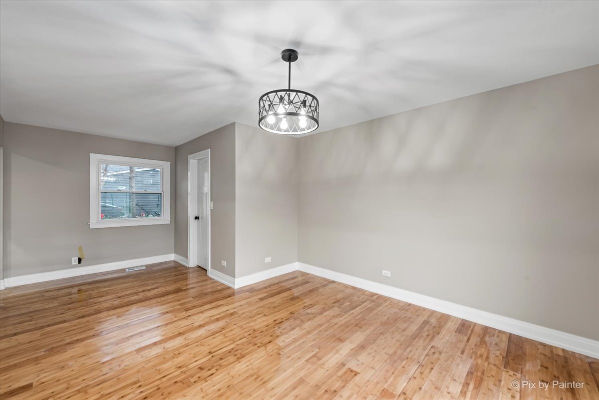 542 East Briarcliff Road Bolingbrook, IL 60440 - Photo 10 of 26 wooden floor in an empty room