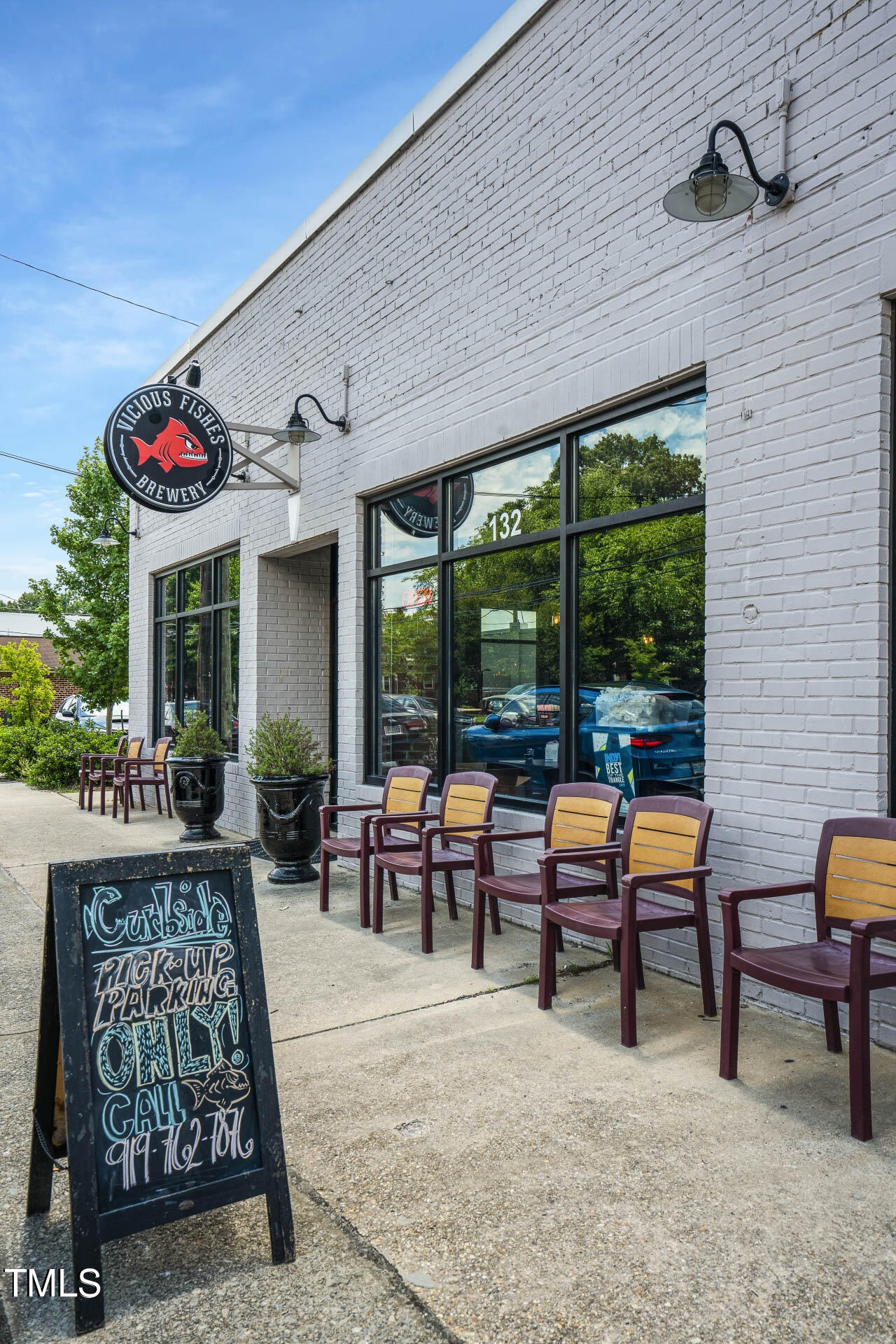 682 Old Station Pointe Angier, NC 27501 - Photo 13 of 15 a living room with furniture and a floor to ceiling window