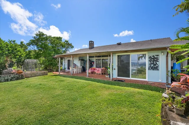 a front view of a house with a garden and porch