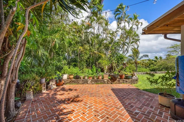 a living room with fireplace furniture and a large window
