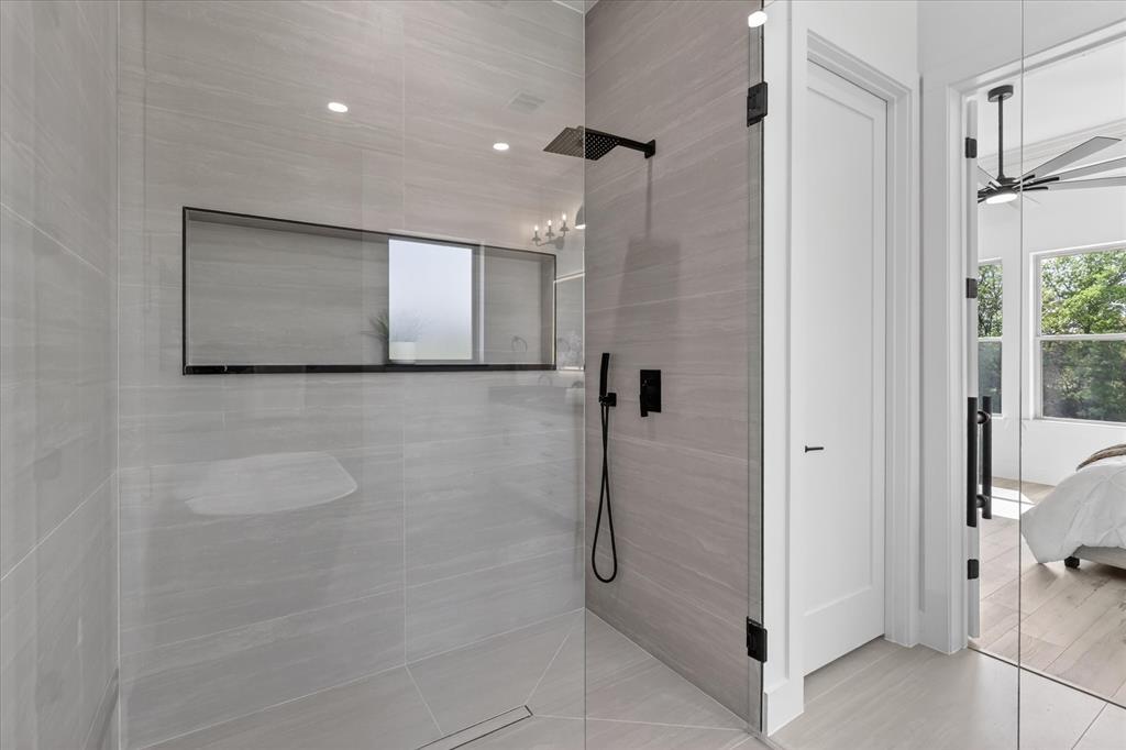 182 Briar Patch Azle, TX 76020 - Photo 20 of 36 Ensuite bathroom with walk in shower and a ceiling fan