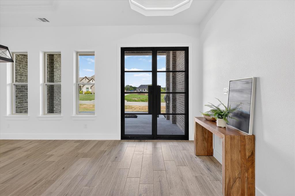 182 Briar Patch Azle, TX 76020 - Photo 3 of 36 Doorway featuring wood finished floors and baseboards