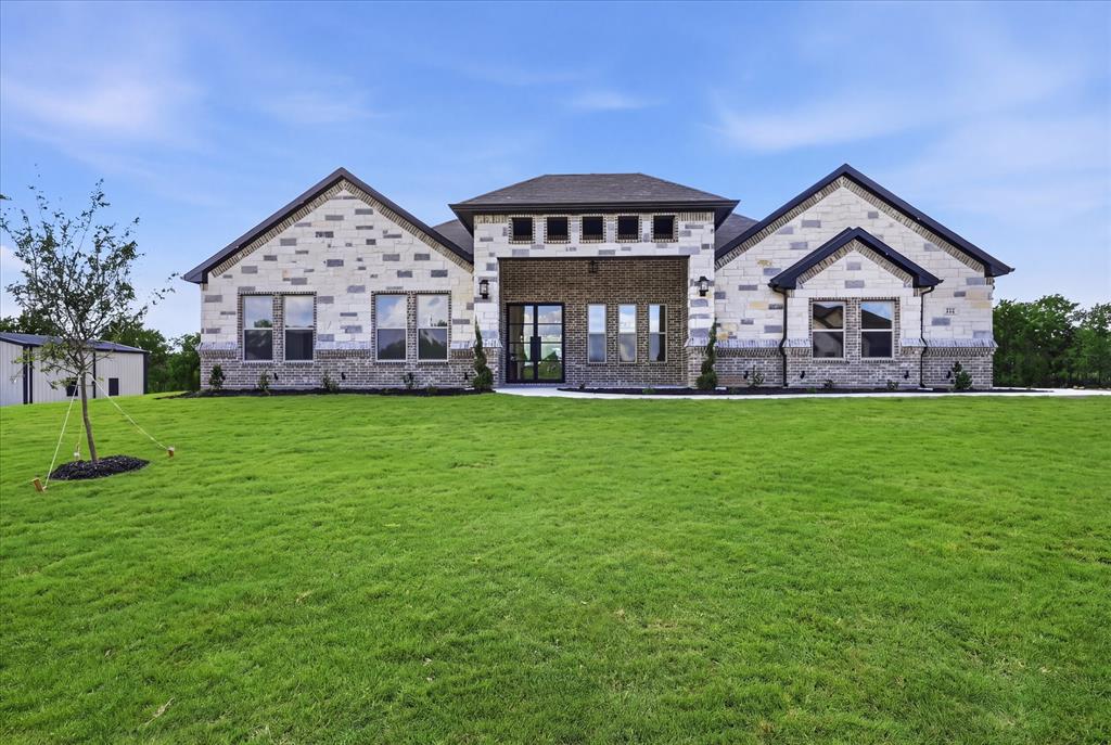182 Briar Patch Azle, TX 76020 - Photo 32 of 36 View of front of home with brick siding, a front lawn, and stone siding