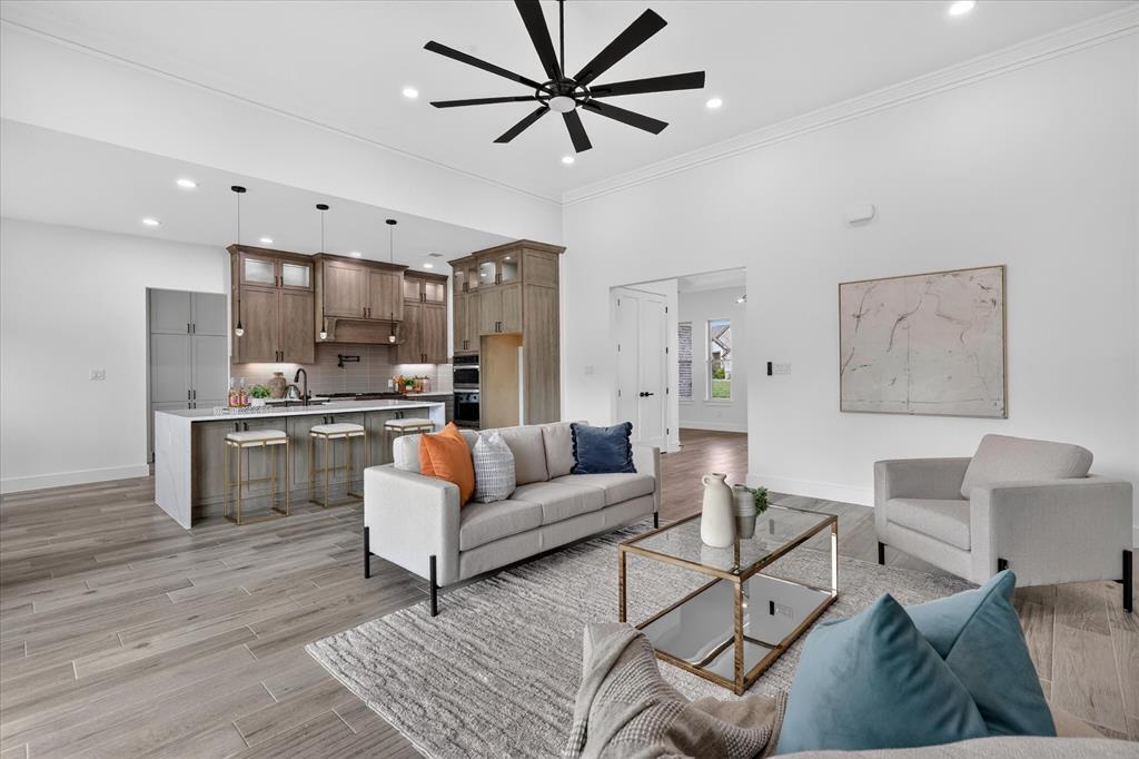 182 Briar Patch Azle, TX 76020 - Photo 9 of 36 Living area with light wood-style flooring, ceiling fan, crown molding, and recessed lighting