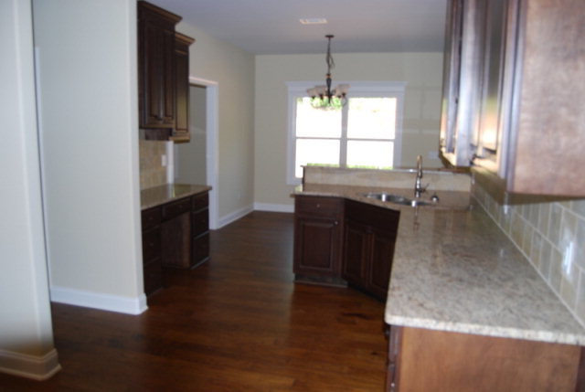 101 Laurel Ridge Forsyth, GA 31029 - Photo 3 of 21 a kitchen with a sink and a refrigerator