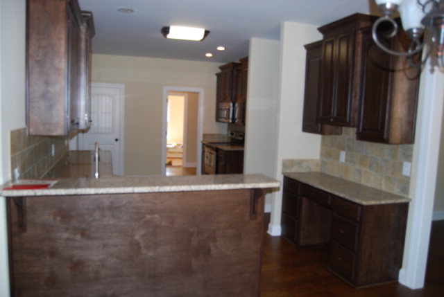 101 Laurel Ridge Forsyth, GA 31029 - Photo 8 of 21 a view of a kitchen with a sink and cabinets