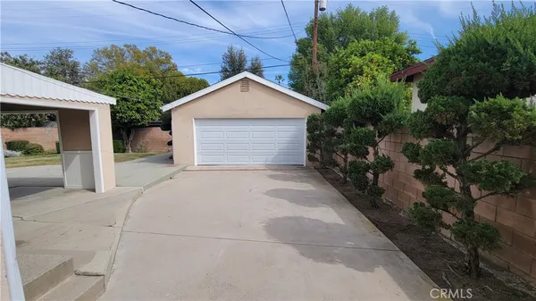 a view of garage and yard