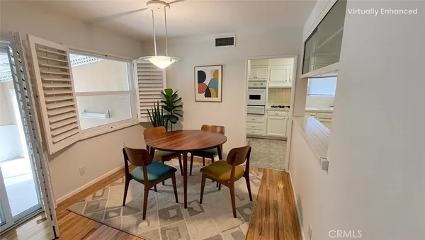 a dining room with furniture and window