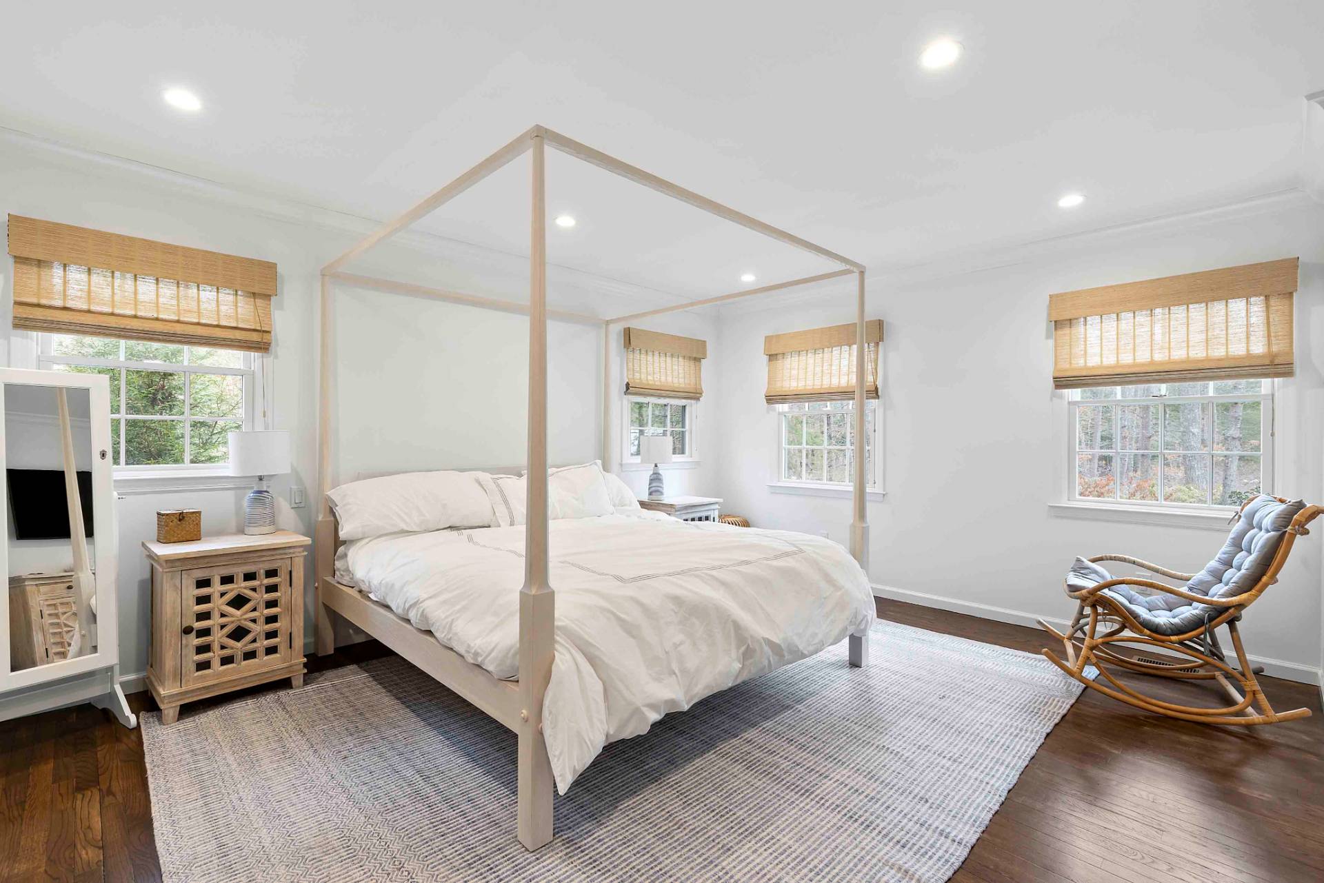 37 Foster Road Quogue, NY 11959 - Photo 5 of 11 a bedroom with a bed chair and three windows
