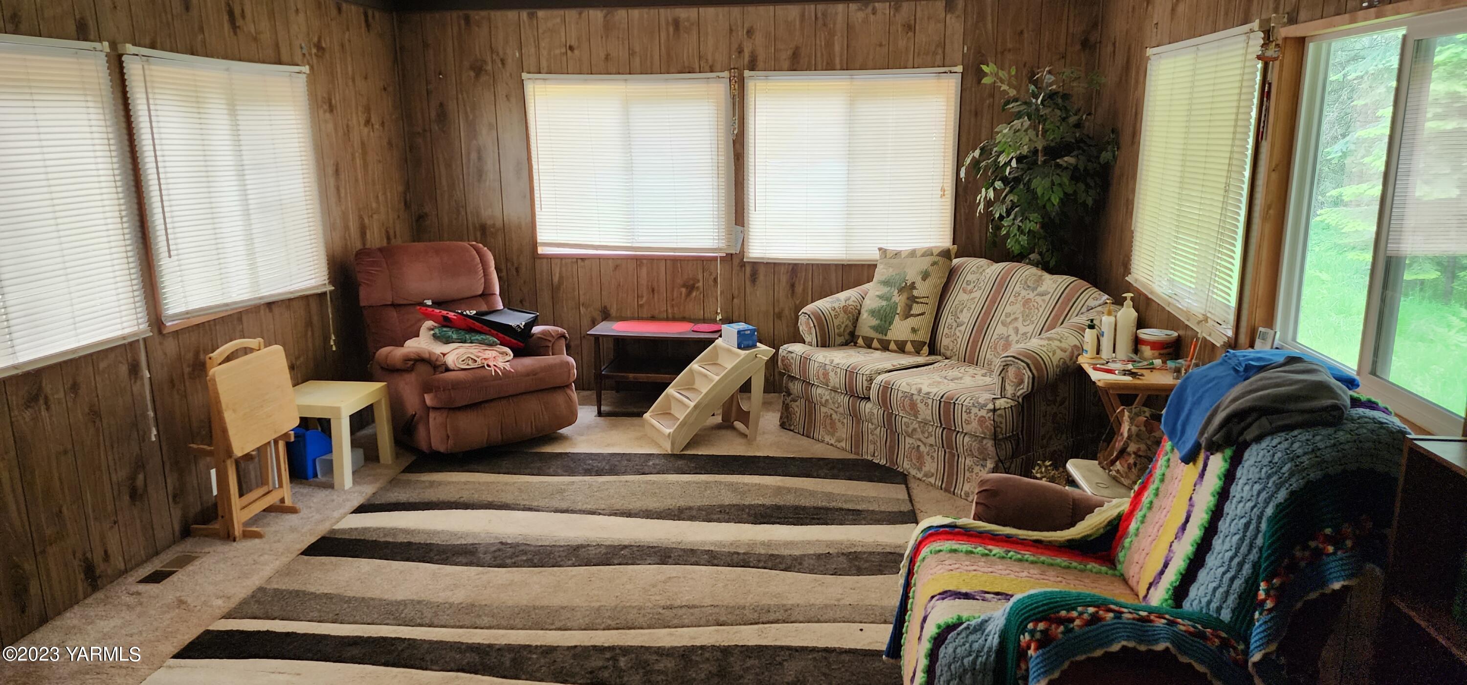 384 Cody Road Anatone, WA 99401 - Photo 16 of 33 a living room with furniture and a large window