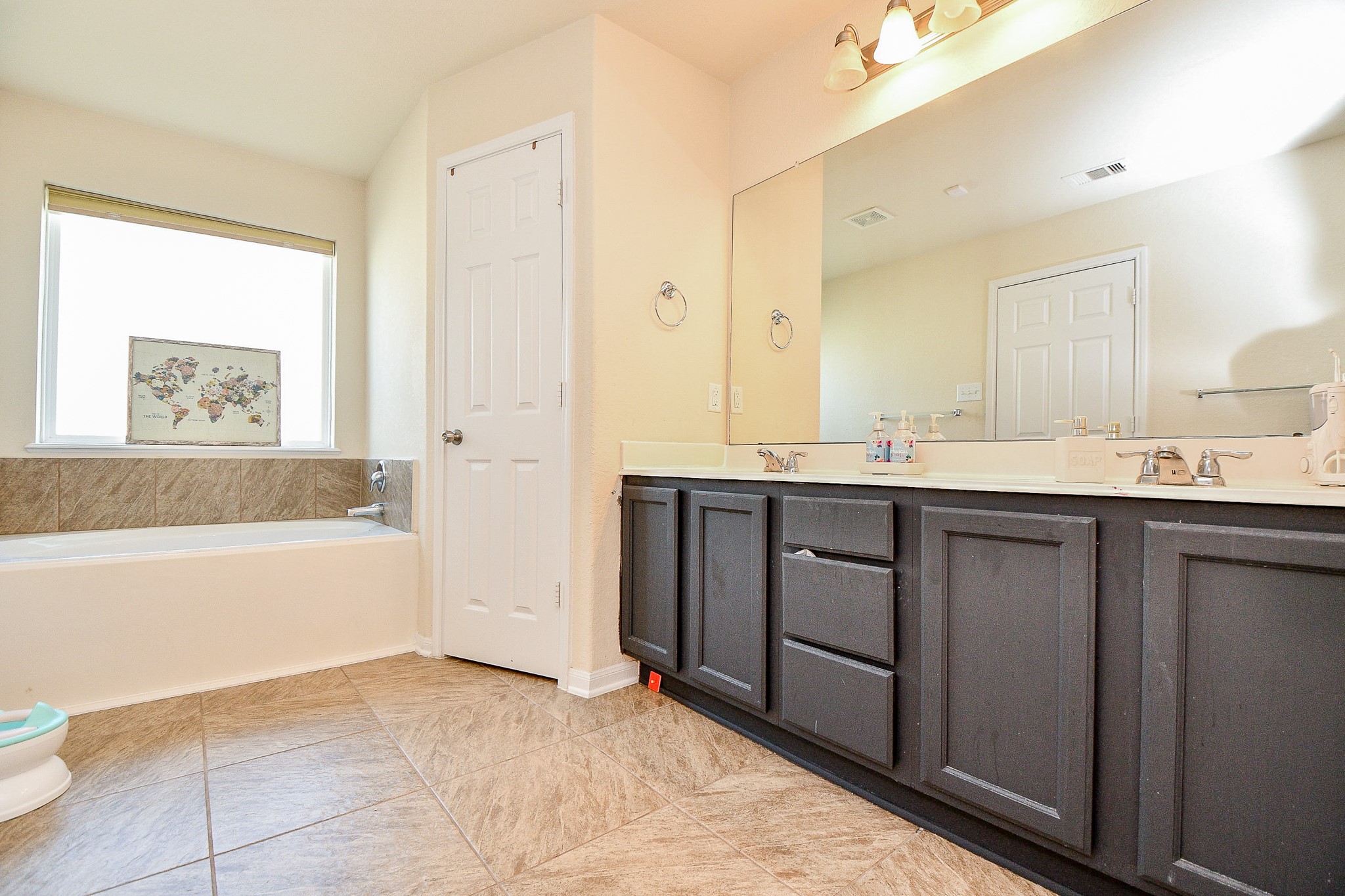 15462 Signal Ridge Way Cypress, TX 77429 - Photo 22 of 37 a spacious bathroom with a tub sink and mirror