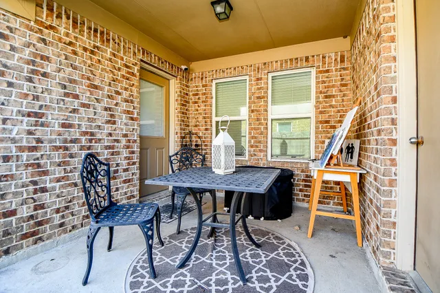 a outdoor space with patio the couches and a dining table with garden view