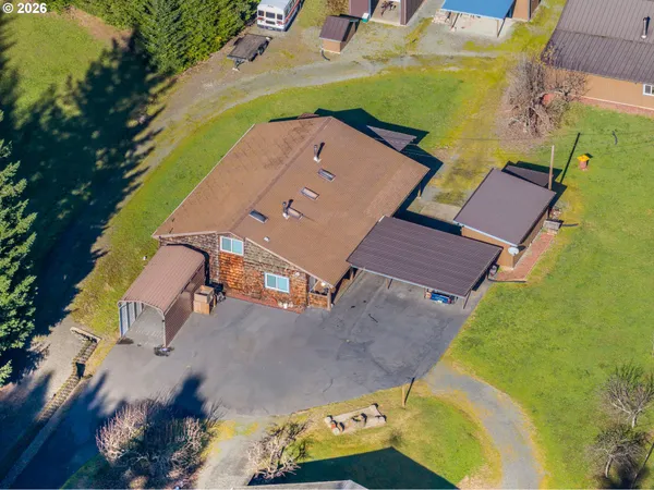 an aerial view of a house with a swimming pool