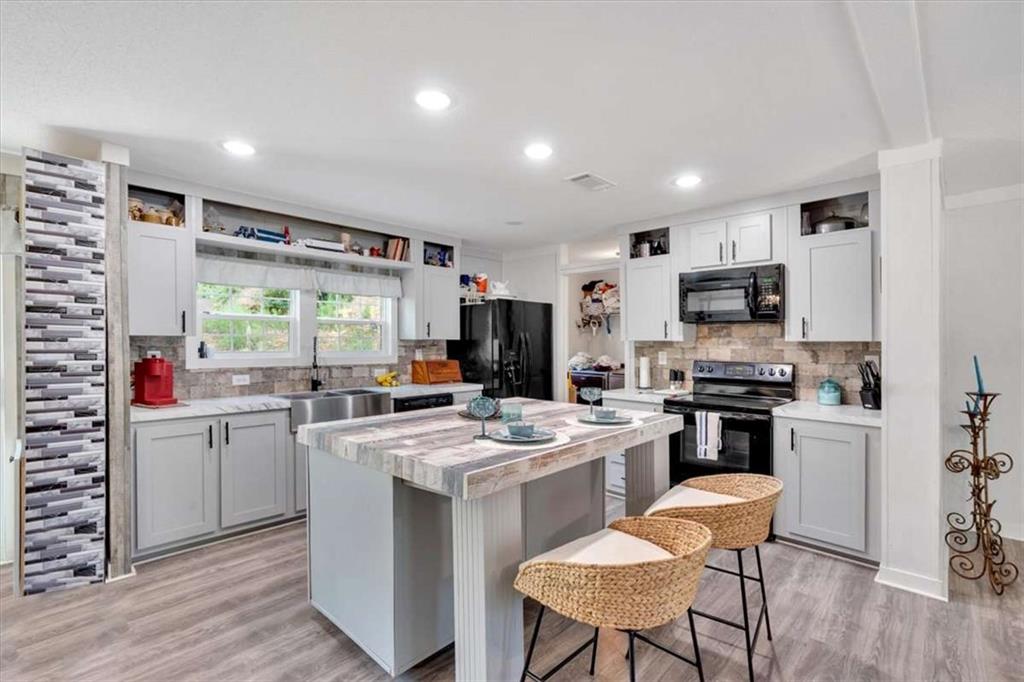 196 Whitestone Drive Talking Rock, GA 30175 - Photo 12 of 62 a kitchen that has a lot of cabinets in it and appliances
