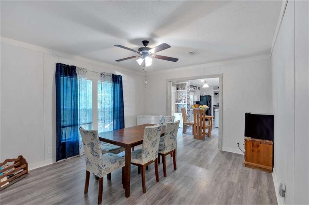 196 Whitestone Drive Talking Rock, GA 30175 - Photo 20 of 62 a view of a dining room with furniture and wooden floor