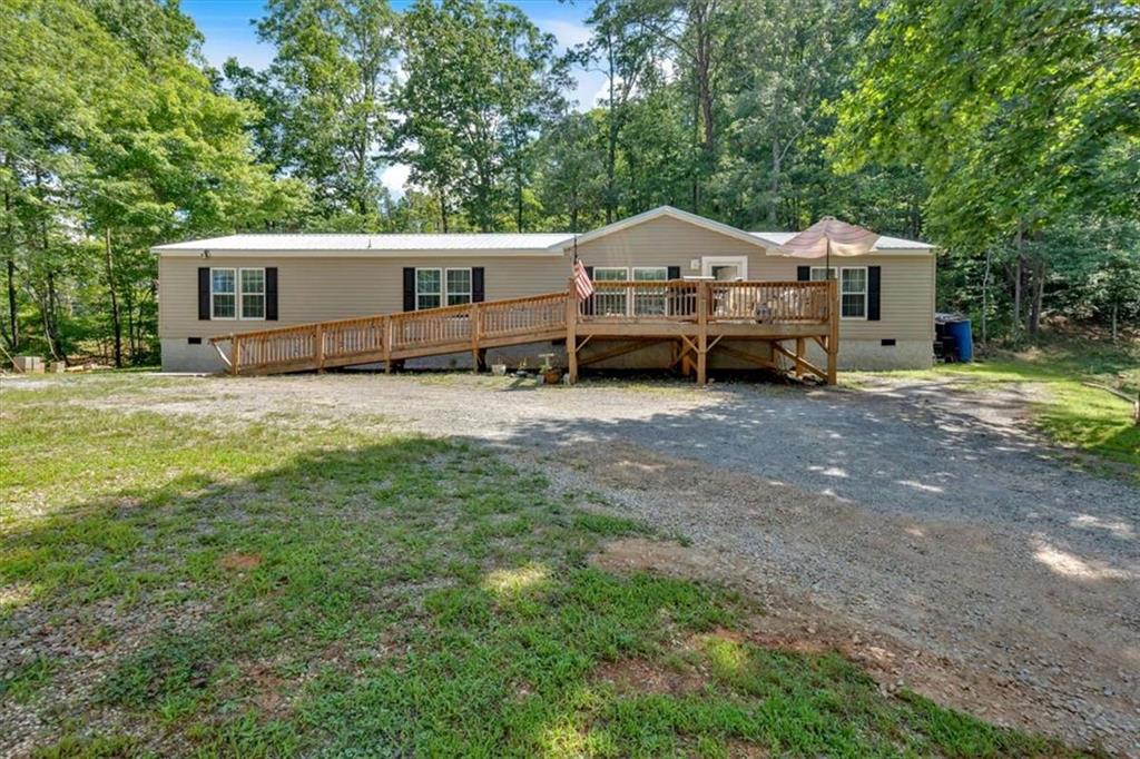 196 Whitestone Drive Talking Rock, GA 30175 - Photo 2 of 62 a view of a house with a truck parked in a yard