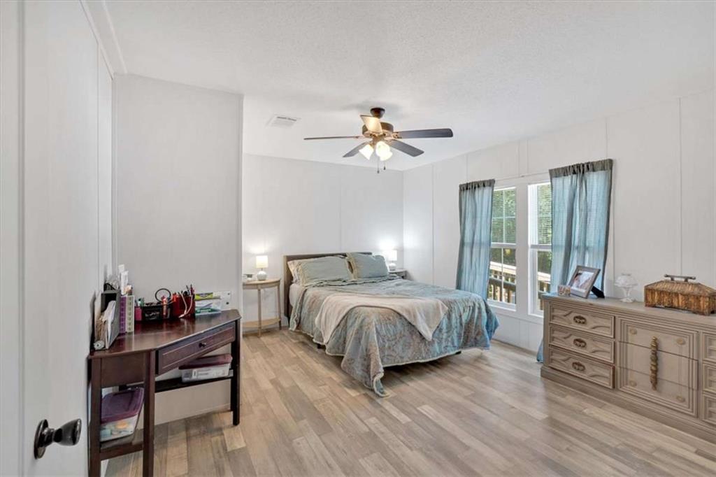 196 Whitestone Drive Talking Rock, GA 30175 - Photo 23 of 62 a bedroom with a bed and a table in it