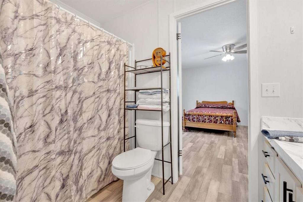 196 Whitestone Drive Talking Rock, GA 30175 - Photo 25 of 62 a bathroom with a toilet and a shower