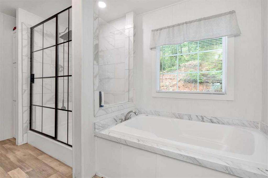 196 Whitestone Drive Talking Rock, GA 30175 - Photo 32 of 62 a white bath tub sitting next to a shower