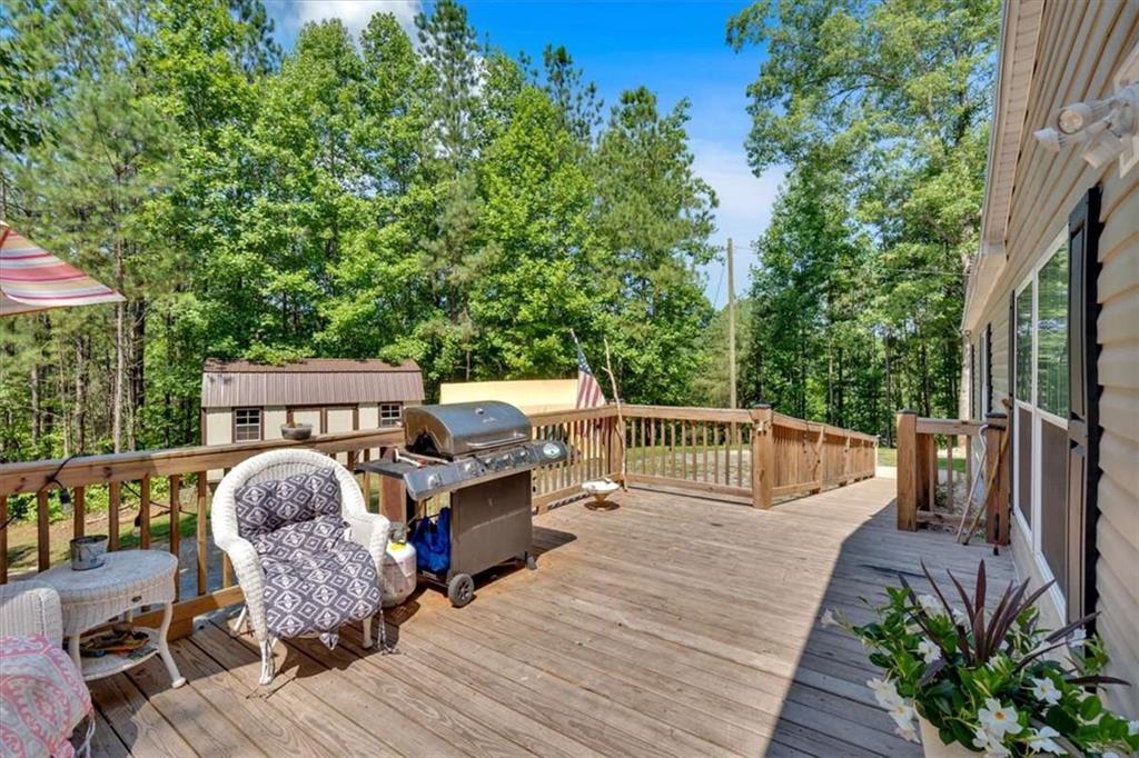 196 Whitestone Drive Talking Rock, GA 30175 - Photo 34 of 62 a view of a deck with chairs a barbeque grill with wooden fence