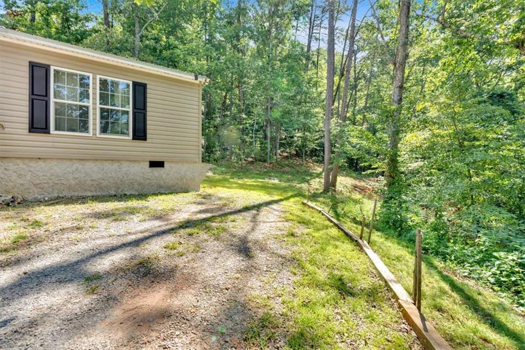 196 Whitestone Drive Talking Rock, GA 30175 - Photo 37 of 62 a view of a house with a backyard