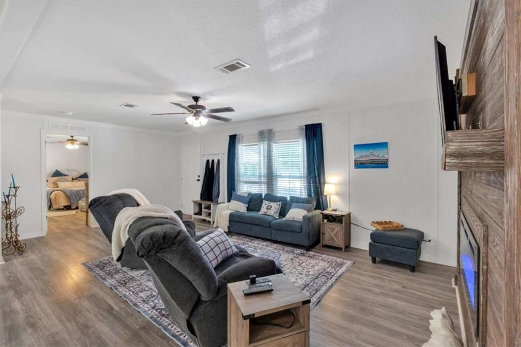 196 Whitestone Drive Talking Rock, GA 30175 - Photo 7 of 62 a living room with furniture and a fireplace