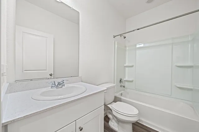 a bathroom with a sink toilet and a bathtub