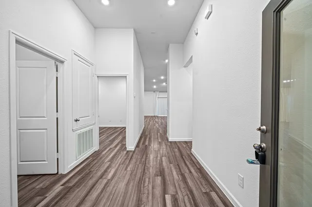 a view of a bathroom with a sink and glass door