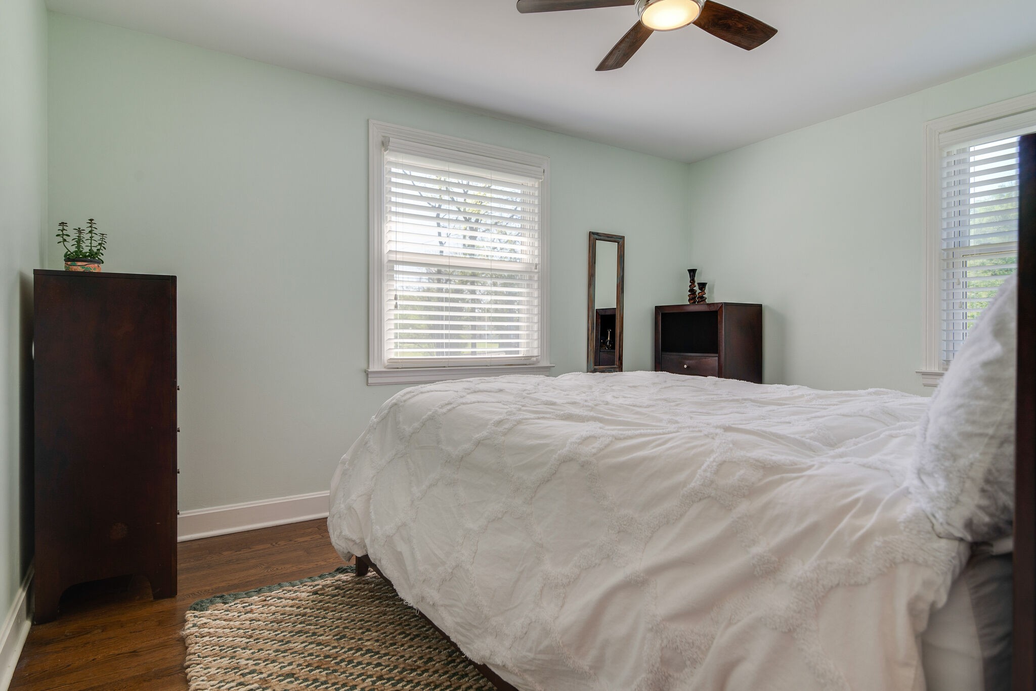 1213 Neelys Bend Road Madison, TN 37115 - Photo 15 of 36 a bed sitting in a bedroom next to a window and a chandelier