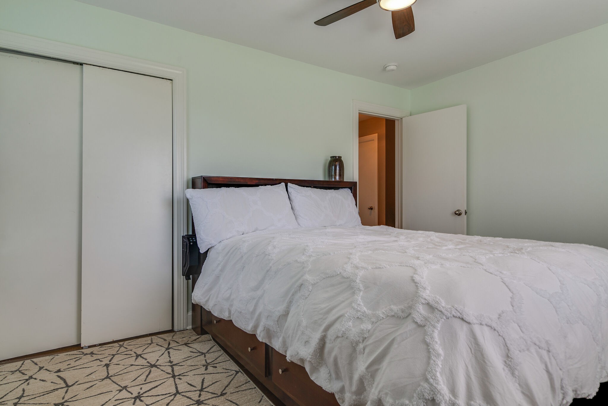 1213 Neelys Bend Road Madison, TN 37115 - Photo 16 of 36 a bedroom with a bed and painting on the wall