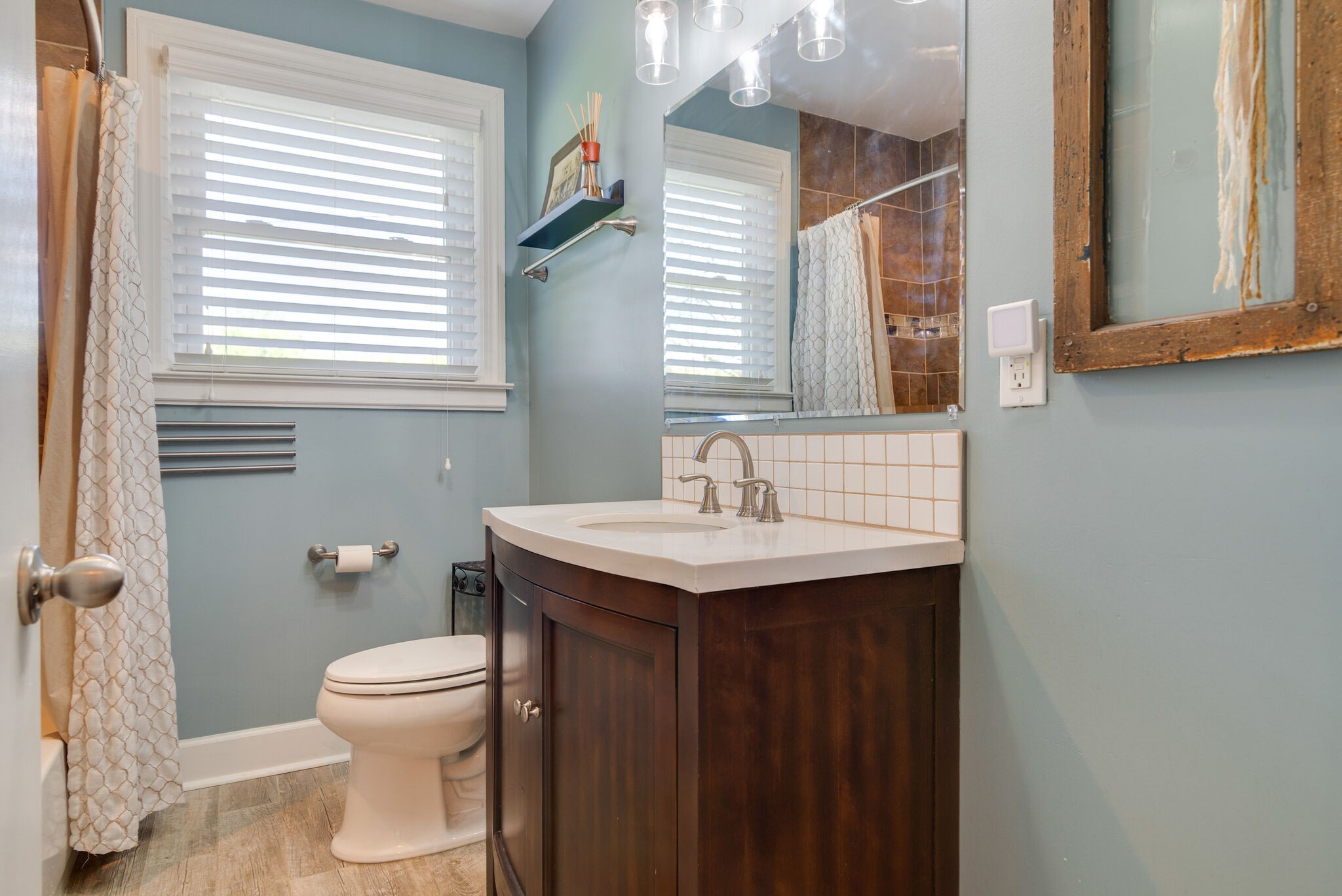 1213 Neelys Bend Road Madison, TN 37115 - Photo 17 of 36 a bathroom with a sink and a toilet