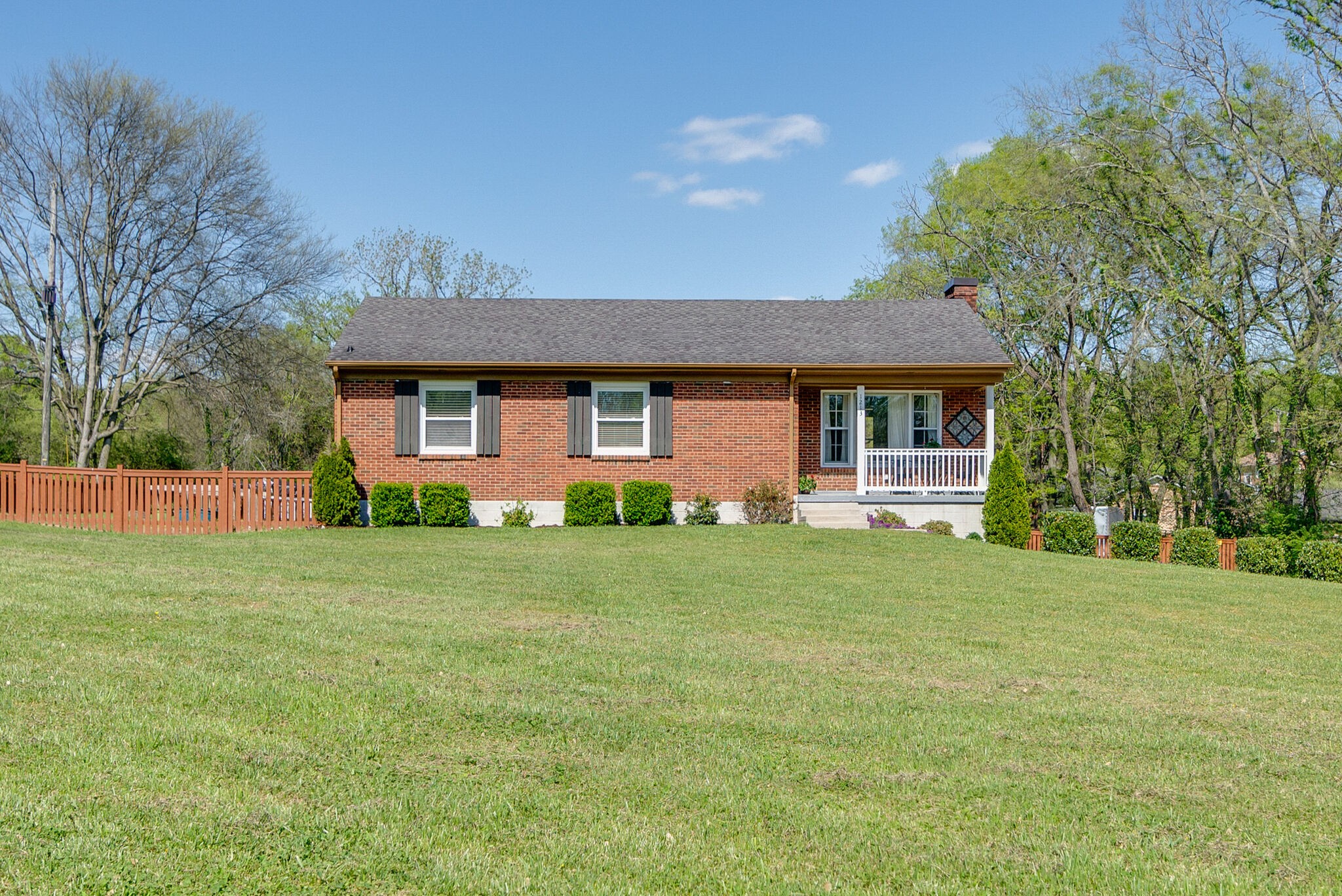 1213 Neelys Bend Road Madison, TN 37115 - Photo 3 of 36 a front view of a house with a yard