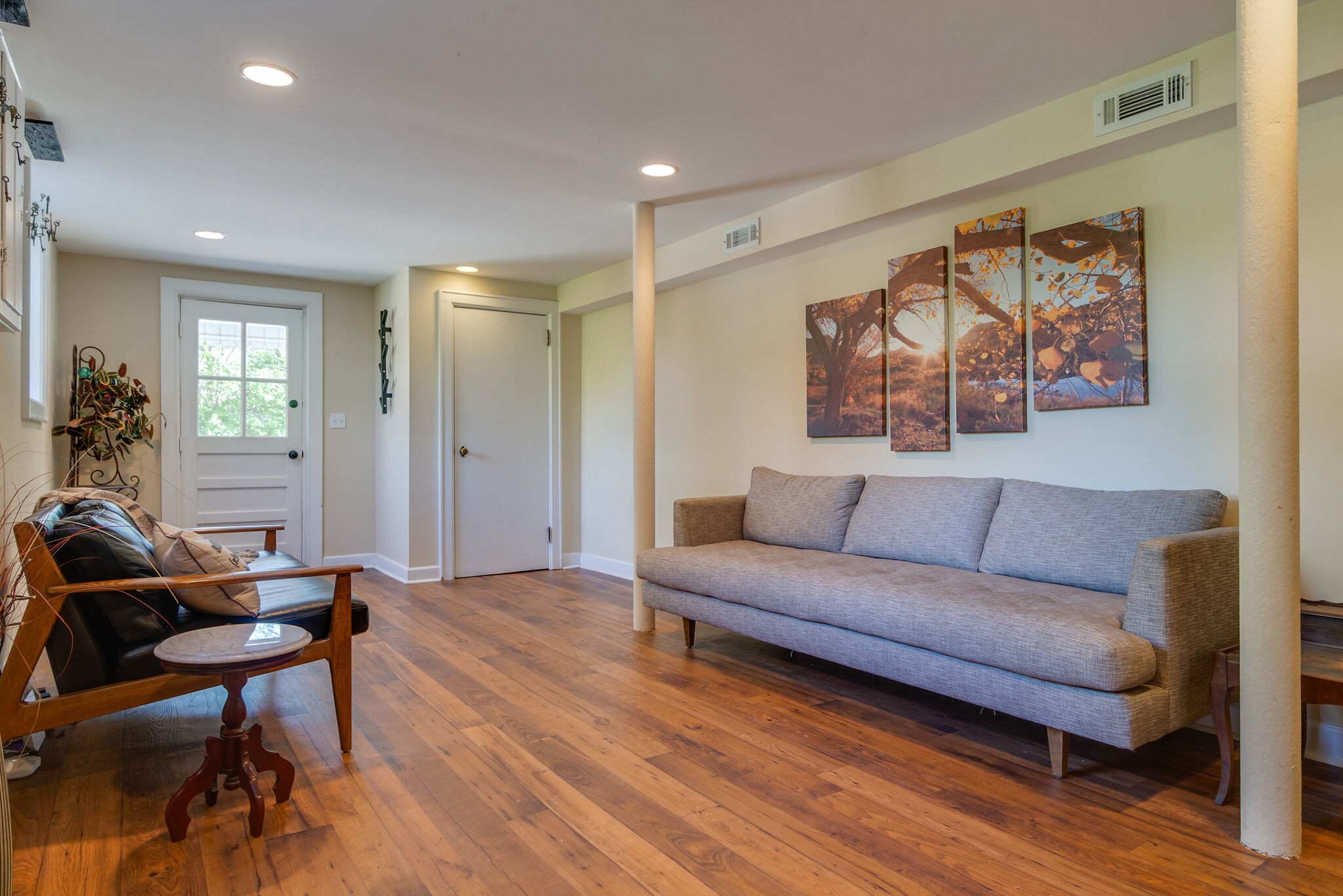 1213 Neelys Bend Road Madison, TN 37115 - Photo 22 of 36 a living room with furniture and a wooden floor