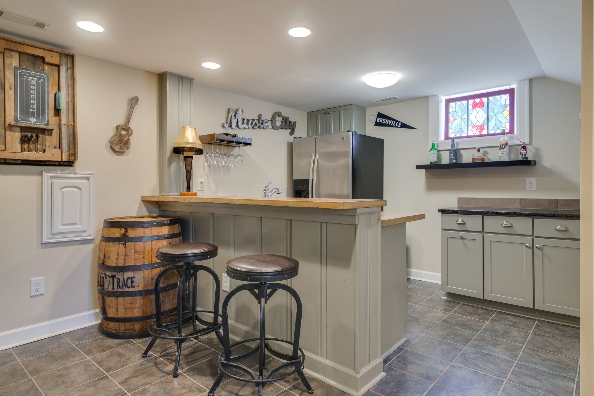 1213 Neelys Bend Road Madison, TN 37115 - Photo 25 of 36 a kitchen with stainless steel appliances granite countertop a stove a refrigerator and a cabinets