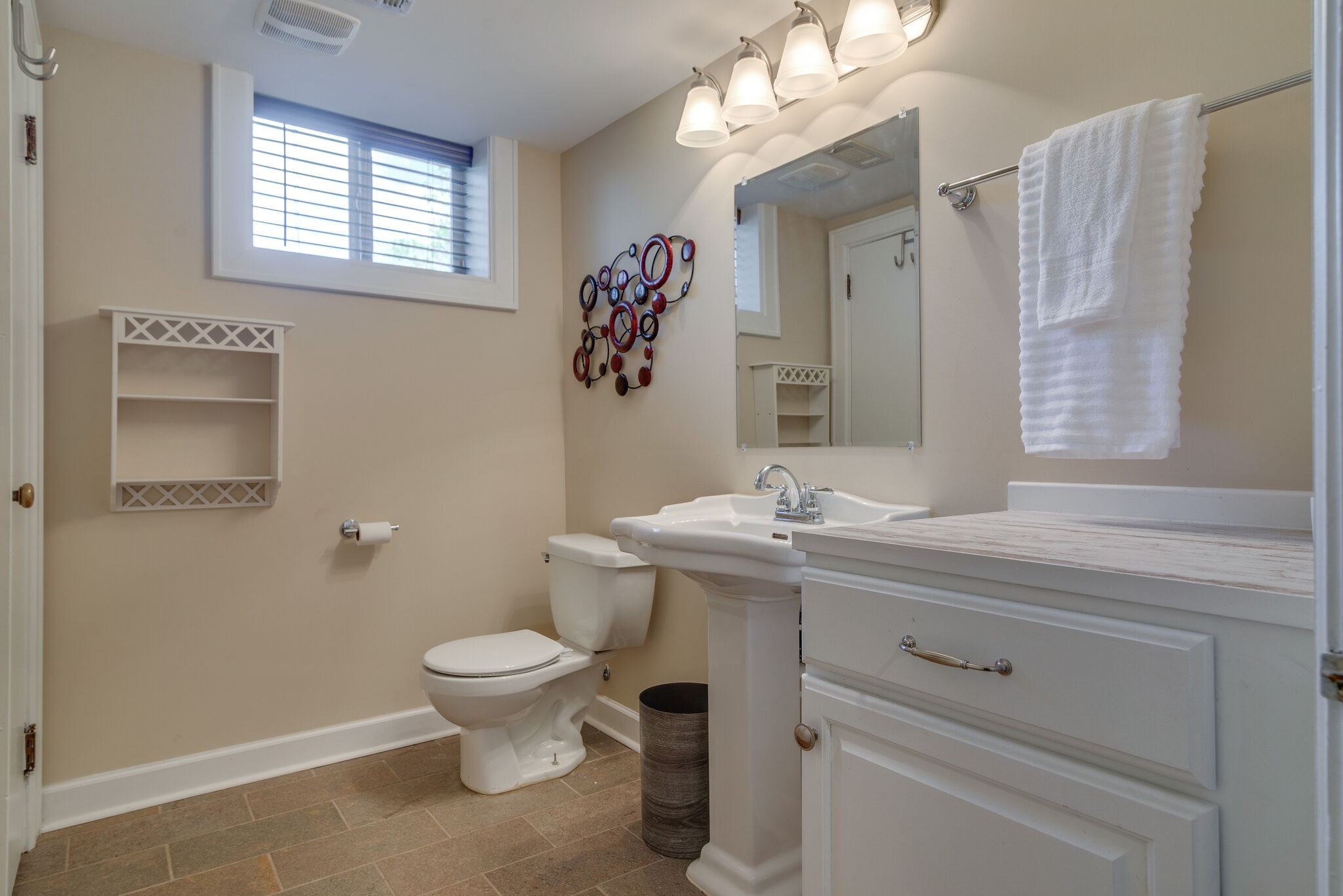 1213 Neelys Bend Road Madison, TN 37115 - Photo 27 of 36 a bathroom with a toilet a sink and a mirror