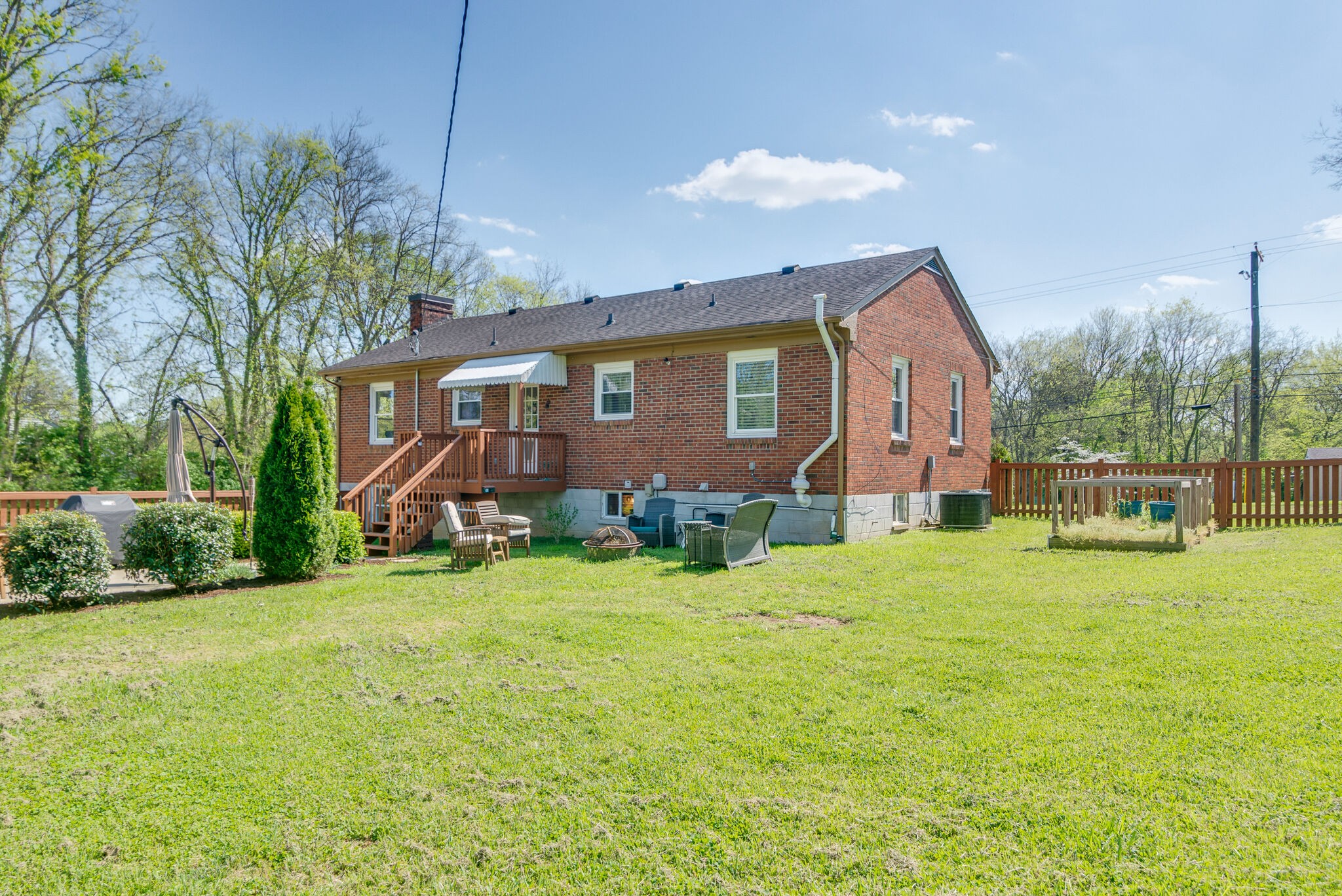 1213 Neelys Bend Road Madison, TN 37115 - Photo 34 of 36 a front view of house with yard and garage