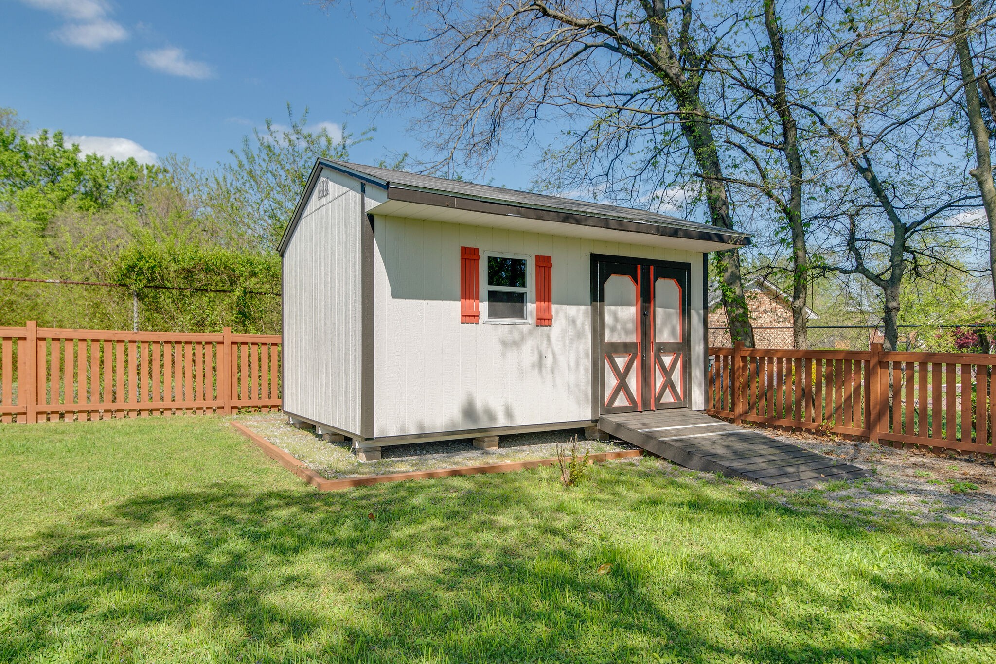1213 Neelys Bend Road Madison, TN 37115 - Photo 36 of 36 a view of a house with a yard and wooden fence