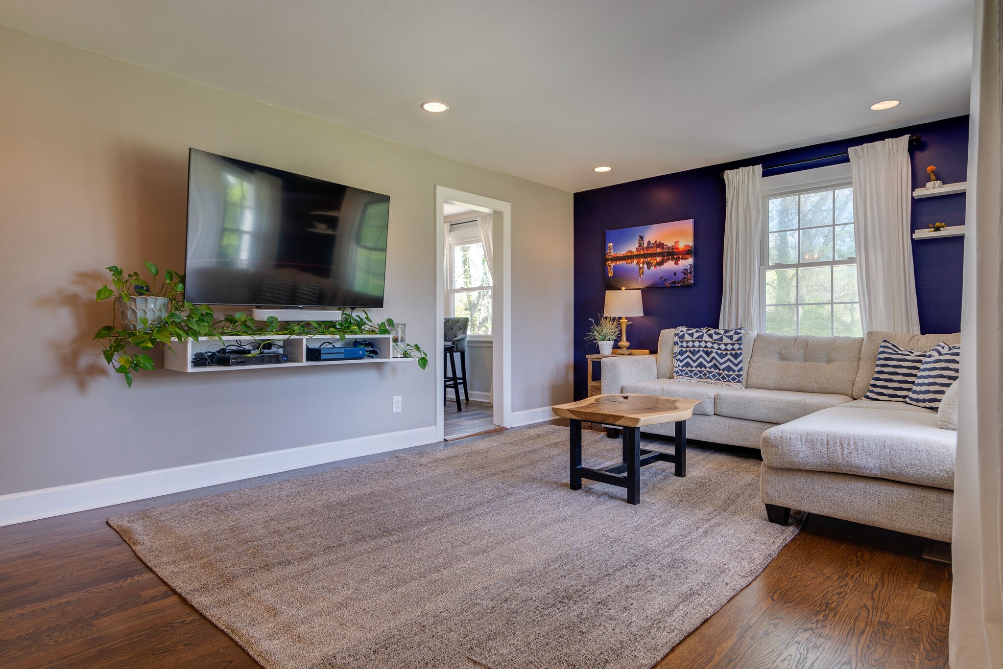 1213 Neelys Bend Road Madison, TN 37115 - Photo 6 of 36 a living room with furniture and a flat screen tv