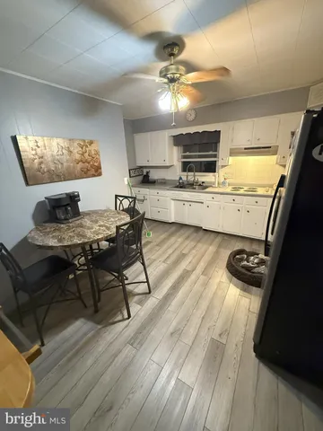 a living room with furniture and flat screen tv