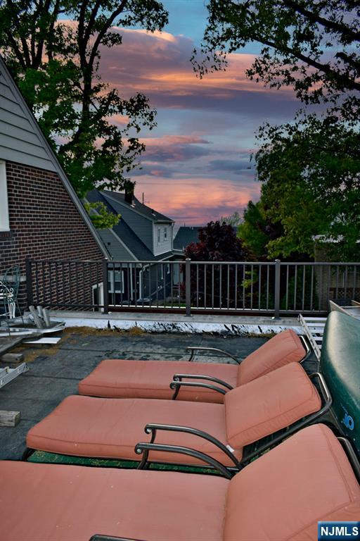 585 Monroe Place Ridgefield, NJ 07657 - Photo 24 of 28 a view of backyard with swimming pool and outdoor seating