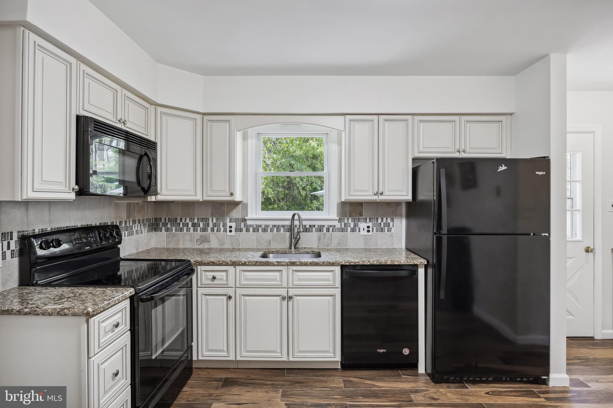 88 Oakshade Road Tabernacle, NJ 08088 - Photo 12 of 34 a kitchen with a sink stove and refrigerator