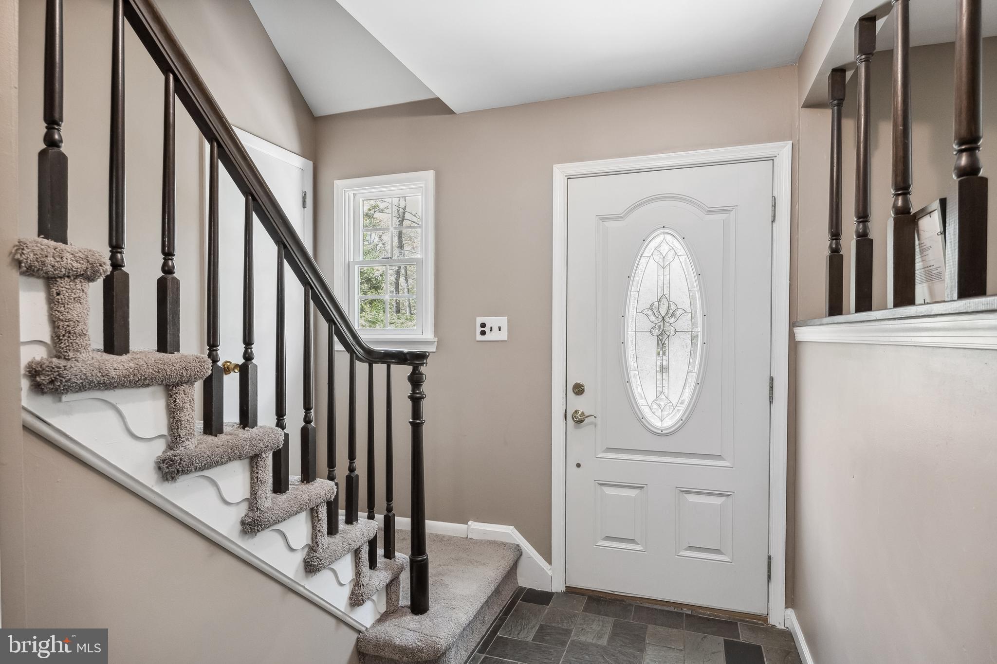 88 Oakshade Road Tabernacle, NJ 08088 - Photo 5 of 34 a view of a hallway with entryway wooden floor and front door
