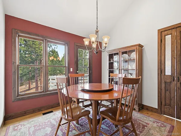 a kitchen with stainless steel appliances granite countertop sink stove and refrigerator