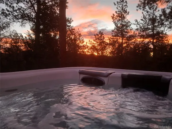 a view of a house with a yard and garage