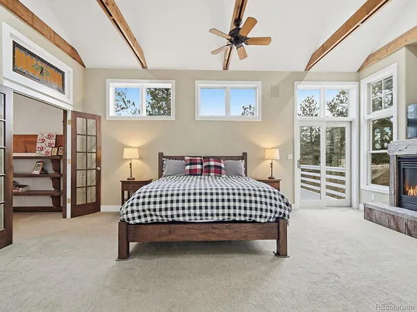 a backyard of a house with lots of tall trees