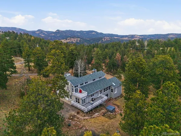 a bedroom with a large bed and a large window