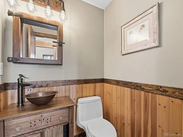 a living room with fireplace furniture and a flat screen tv