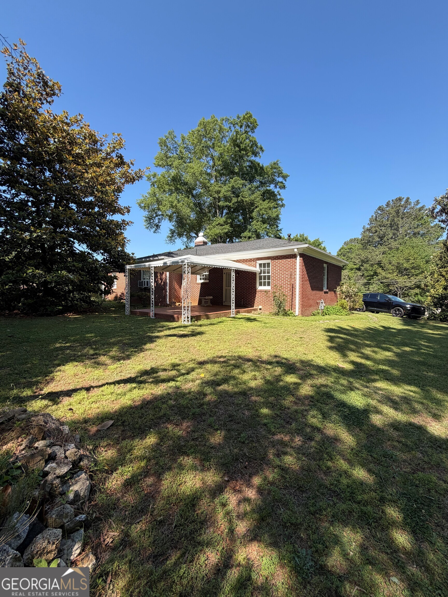 2619 Maple Road Southeast Rome, GA 30161 - Photo 17 of 31 a view of a house with a big yard