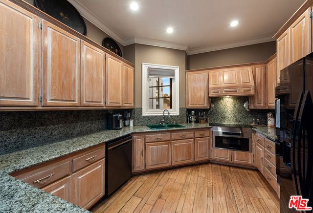a kitchen with lots of counter top space and a sink