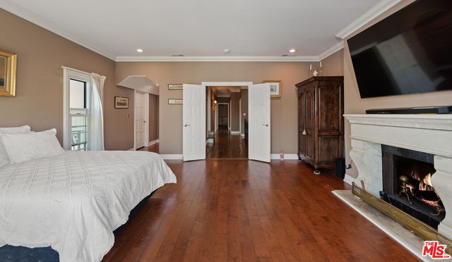 a spacious bathroom with a double vanity sink a mirror a bathtub and a shower